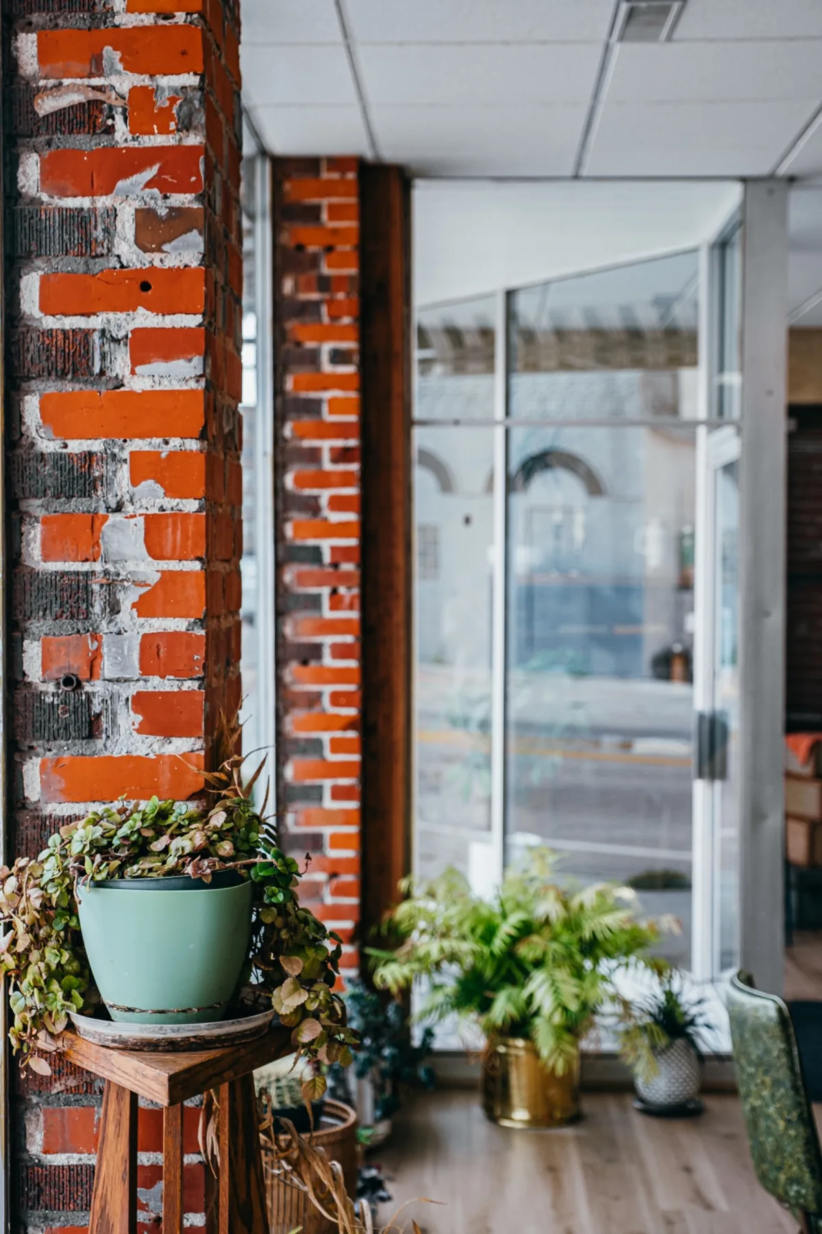Coal and Feed storefront entrance framed by painted red brick.