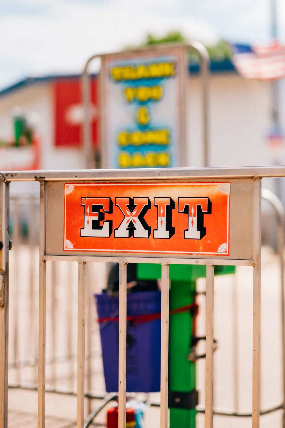 Z-Mann 2nd Hand Store sign above a carnival game booth.