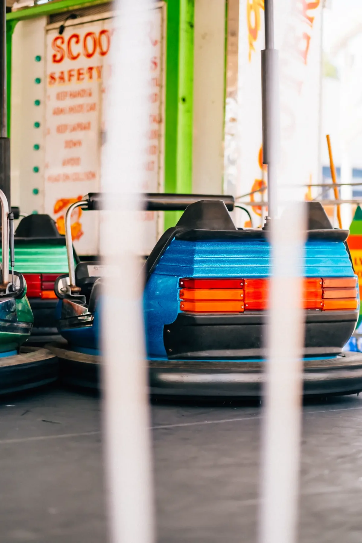 Skee-Ball attendant and game counter at a carnival midway.