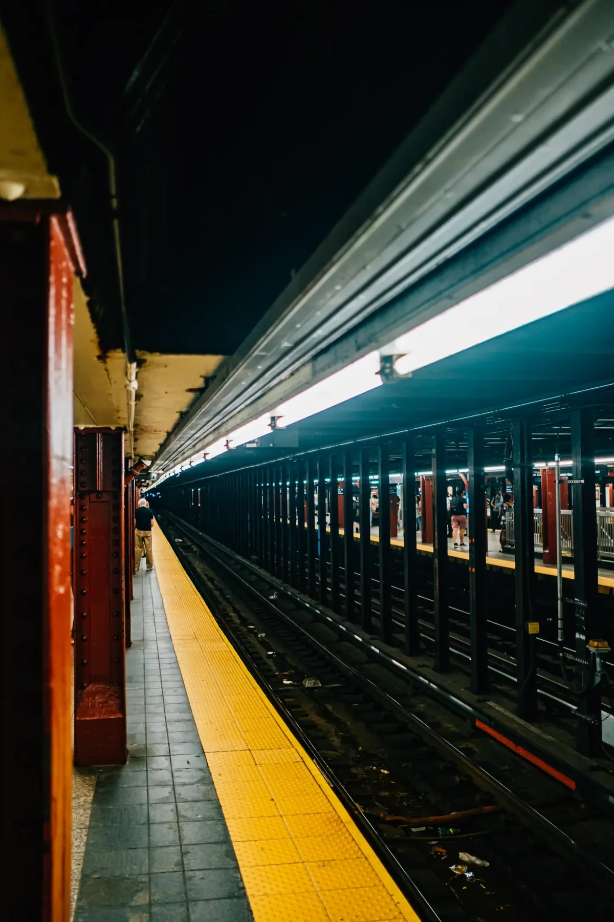 Night platform at a New York City subway station.