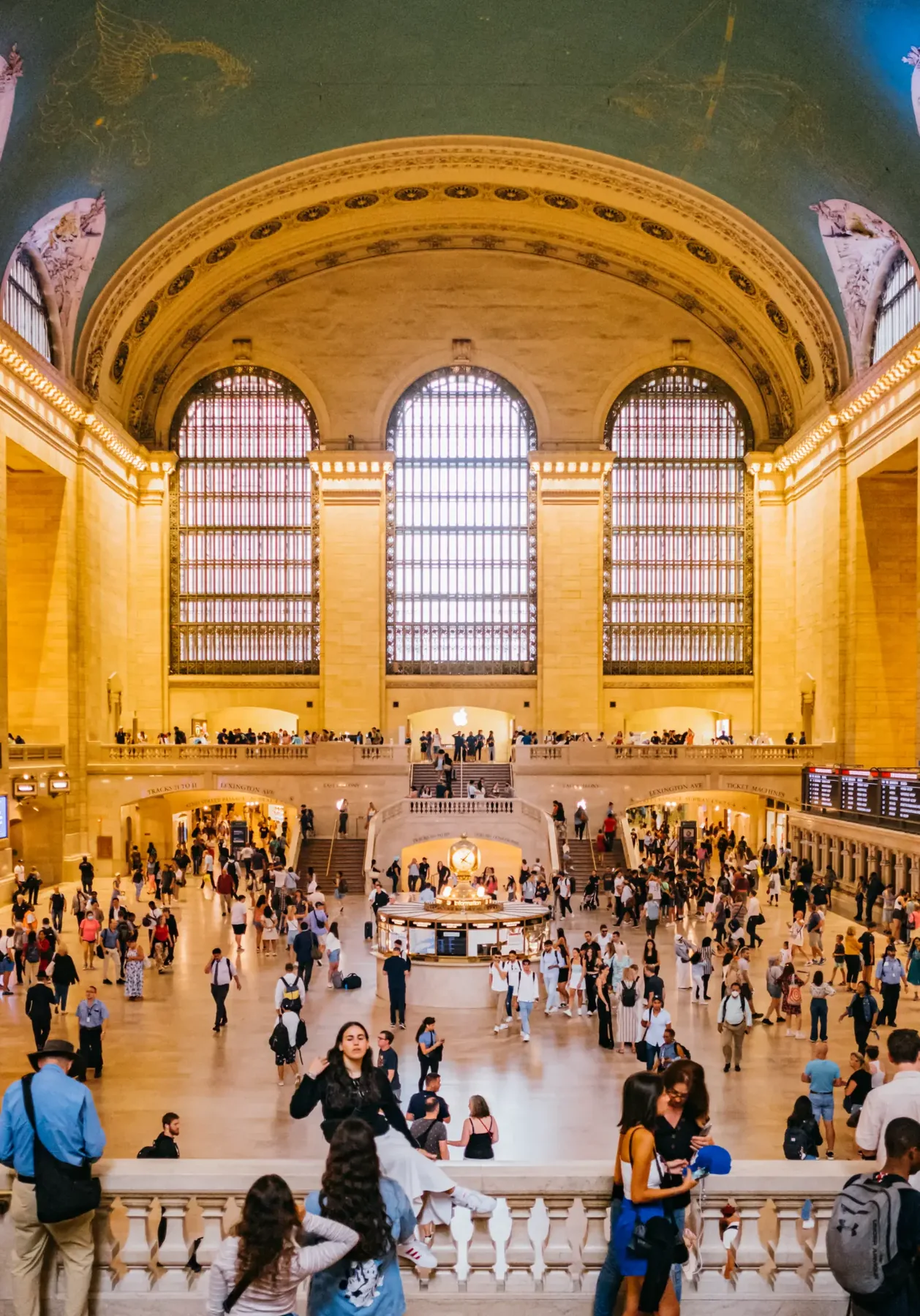 Crowds moving through Grand Central Terminal's main concourse.